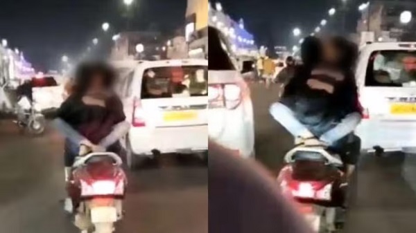बीच सड़क चलती स्कूटी पर कपल का रोमांस, वीडियो वायरल होने पर ... - CG Sandesh